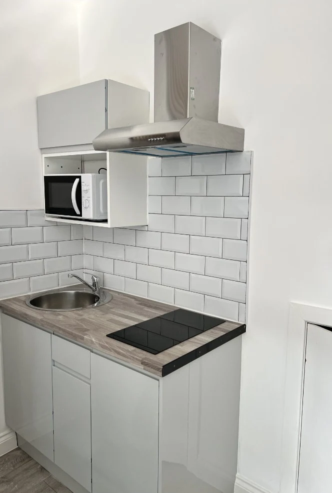 Compact kitchenette with sink, hob, extractor and microwave